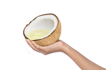 Woman hand holding brown coconut with coconut oil isolated on white background.
