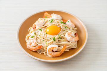spaghetti white cream sauce with shrimps and egg yolk