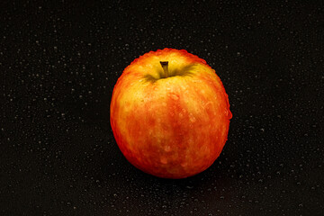 Apple pink lady isolated in black background - using studio lights