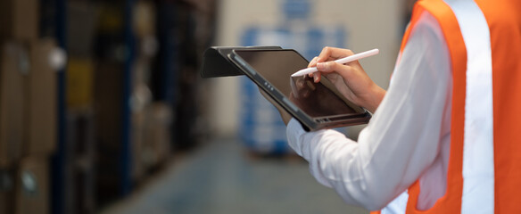 Panoramic close up hand of smart engineer man warehouse management system.Worker hands holding...