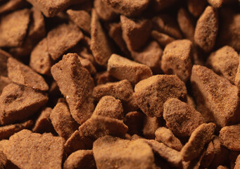 Instant coffee granules as background.