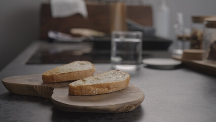 sliced ciabatta bread on olive board