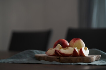ripe nectarines on wood board with natural lighting