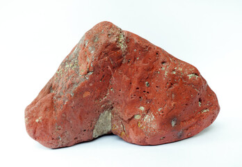 Macro shooting of raw specimen red jasper rock isolated on white background.