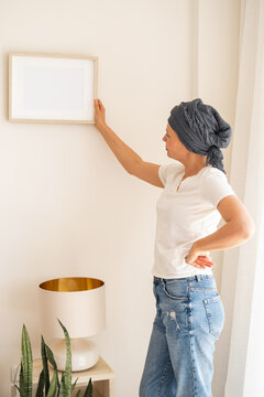 A wooden frame with empty space in women's hands