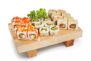 Colorful sushi maki set: cali, salmon, harumali on board isolated on white background