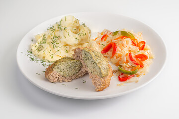Сlose up Homemade fried Fish and pork Cutlet, mashed potatoes and salad with sauerkraut on white plate isolated. Banner menu recipe.