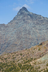 The mountains and peaks with glaciers of Alta Valmalenco, A splendid area of the Italian Alps, in Valtellina, near the town of Chiesa in Valmalenco, Italy - September 2021.