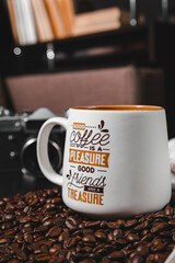 Big cup of coffee on coffee beans