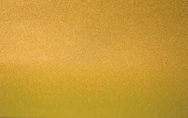 glittering golden background texture for christmas decorations, selection focus 