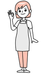 OKサインを出すエプロン姿の若い女性