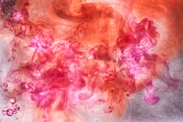 Orange pink smoke background, colorful fog, abstract swirling ink ocean sea, acrylic paint pigment underwater