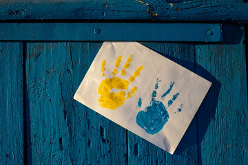 Love Ukraine concept. Hands painted in Ukraine flag color - yellow and blue. Independence day of Ukraine, Flag, Constitution day Education, school, art painitng concept

