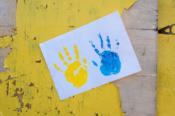 Love Ukraine concept. Hands painted in Ukraine flag color - yellow and blue. Independence day of Ukraine, Flag, Constitution day Education, school, art painitng concept
