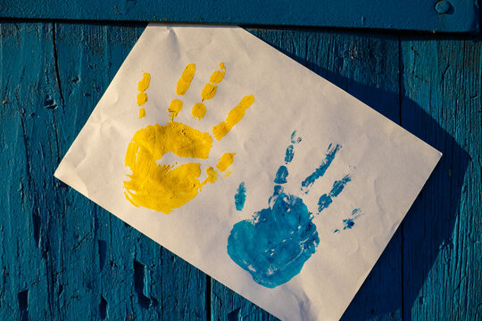 Love Ukraine concept. Hands painted in Ukraine flag color - yellow and blue. Independence day of Ukraine, Flag, Constitution day Education, school, art painitng concept