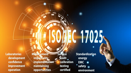 A man's hand is pointing to touch ISO IEC 17025, the global standard for industrial product...