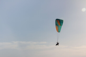 Paragliding with sun in Alanya, parachute with amazing sky , copy space, space for text.