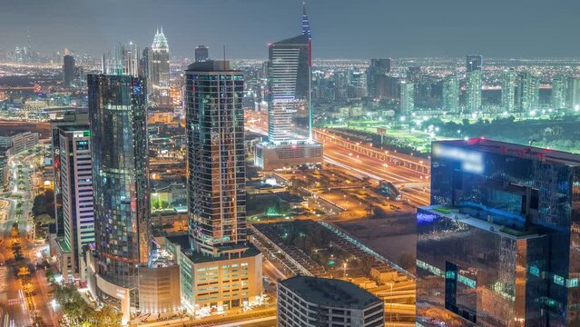 Aerial view of media city and al barsha heights district area night timelapse from Dubai marina.