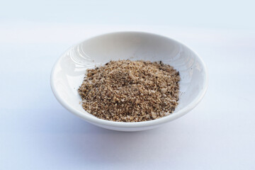Bowl of mixed pepper and salt  isolated on white. Vietnamese pepper and salt seasoning
