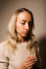 Fototapeta premium A young woman with a very sad face crossed her arms and prayed.