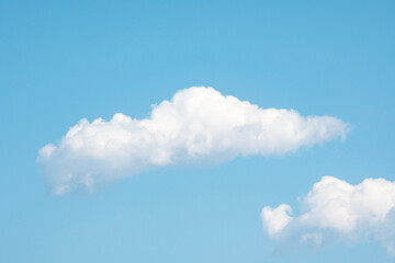 Blue sky with two clowds