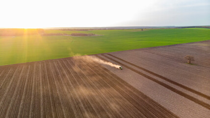Spring Cultivation of Agricultural Land at sunset