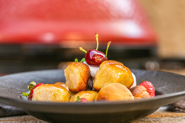The homemade buns. Homemade delish dessert, vanilla sauce, fresh fruit. Close up
