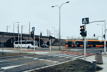 Buses pass at the crossroads.