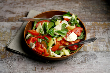 Salad with vegetables and mozzarella.