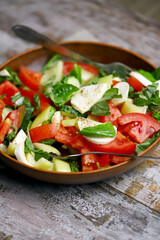 Salad with vegetables and mozzarella.
