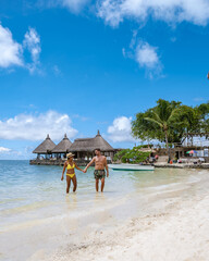 man and woman on a tropical beach in Mauritius, couple on vacation Mauritius
