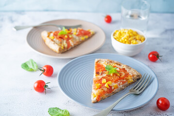 Onion tomato cream cheese whole grain galette in a plate