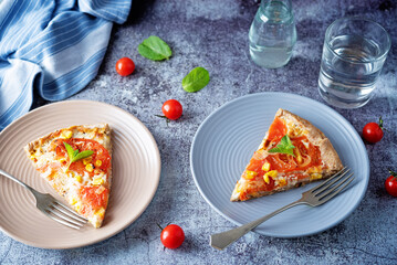 Onion tomato cream cheese whole grain galette in a plate