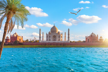 Beautiful Taj Mahal Mausoleum on the bank of the Yumana river, Agra, India - obrazy, fototapety, plakaty
