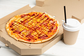 Paper cup of coffee and pizza