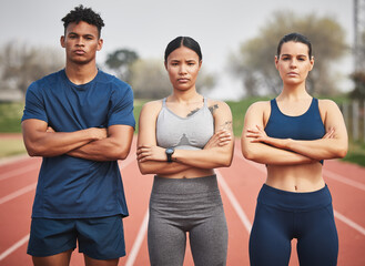 Youre witnessing the winning team. Cropped portrait of three young athletes standing outside with...