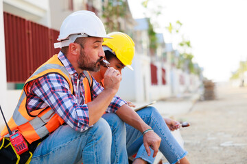 Construction workers rest and eat cream in housing projects. Professional black african american...