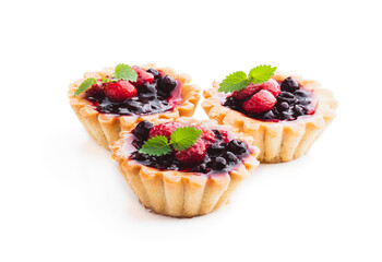 Delicious fruit tarts on wooden table