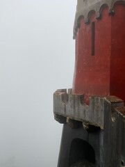 Tower of a castle in Sintra, Portugal covered in fog