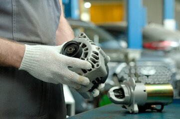 Spare parts. Elements of the electrical system of the car engine. The car generator is in the hands...