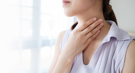 Woman with sore throat inflamed tonsils from influenza symptoms. Healthcare and medical concept