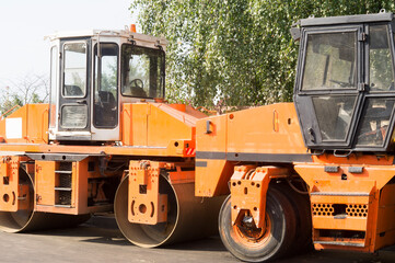 asphalt paver at the construction of an expressway