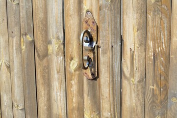 on photo old brown oak doors locked on a lock