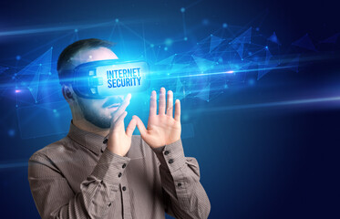 Businessman looking through Virtual Reality glasses, virtual security concept