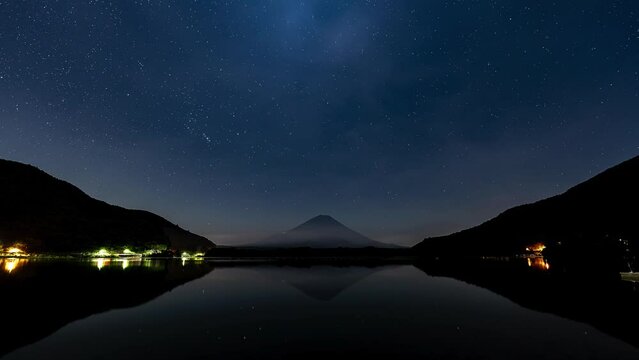 Night sky time laps at mountain Fuji by the lake with peaceful lake reflection