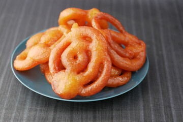 jalebi indian sweet on a plate on table 