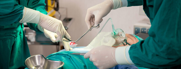 Closeup hands of team doctor and surgeon doing surgery with patient in the operation at hospital, medical and emergency, specialist and assistant rescue patient with expertise, surgical and health.