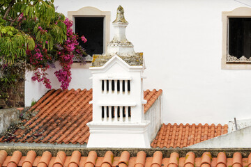 Openwork traditional chimney on a roof in Silves, Algarve, Portugal - obrazy, fototapety, plakaty