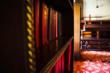 Old historical library bookshelves and books