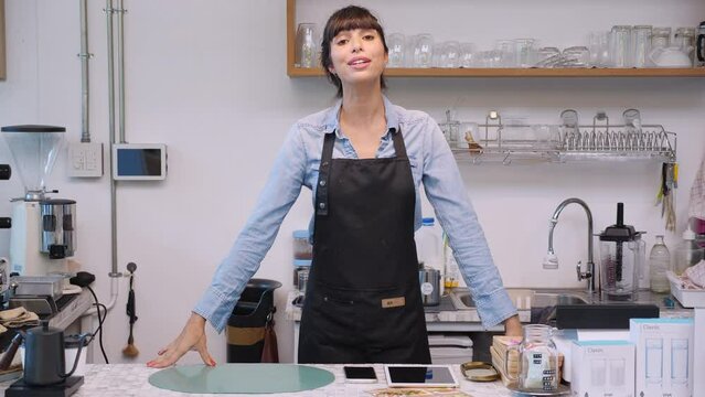 Barista woman introduce and aspirations for presenting small business owner to customer in the cafe, woman recommend occupation while talking and greeting in the coffee shop, retail and service.